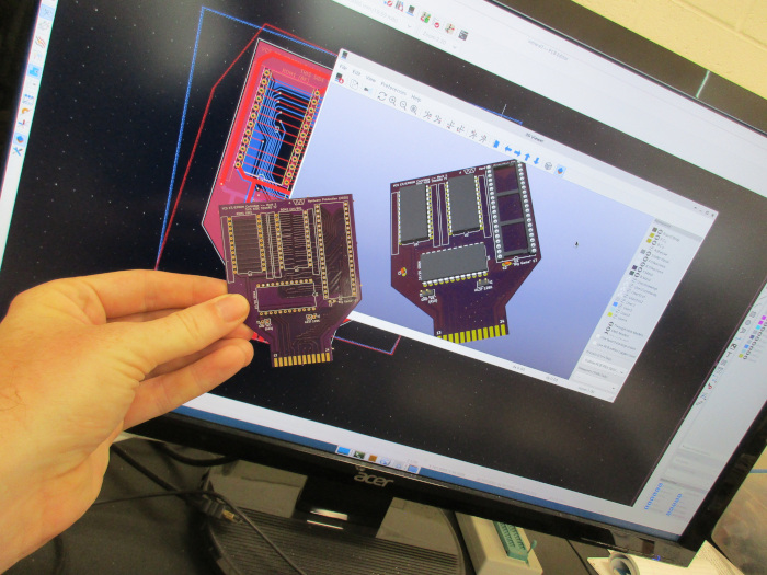 finished board alongside kicad showing same board